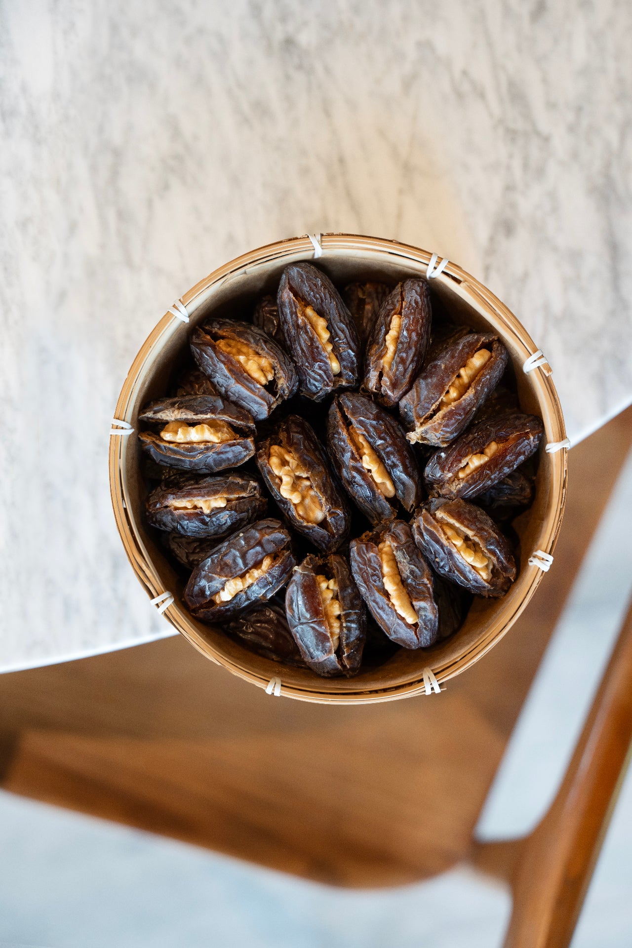 Palestinian Medjool Dates with Walnut in a wooden bowl