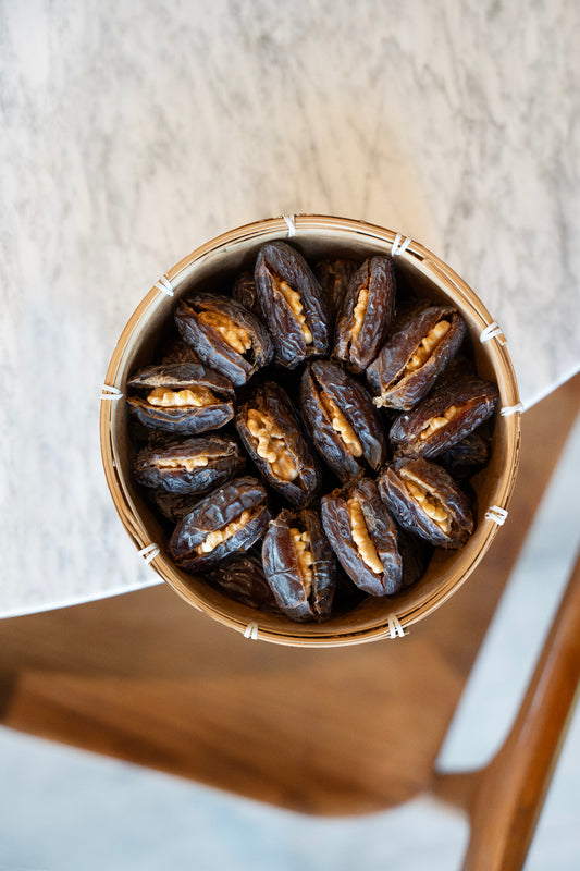 Palestinian Medjool Dates with Walnut in a wooden bowl